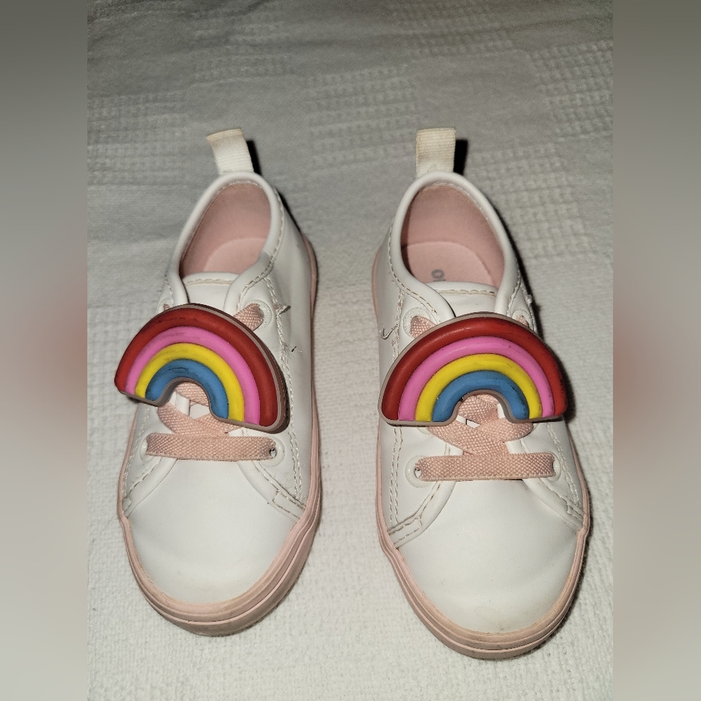 White sneaker with a rainbow attachment
